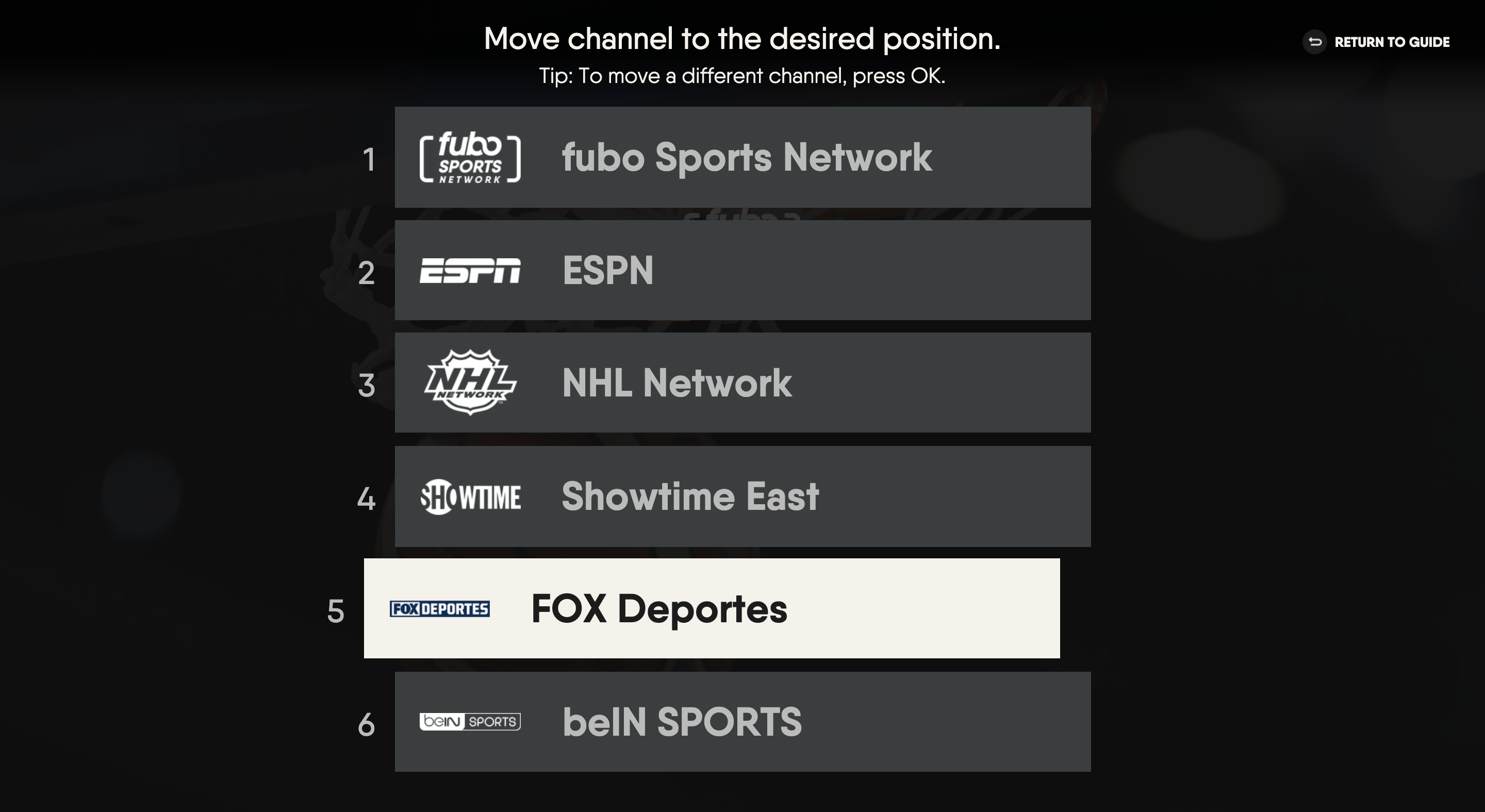 Reordering favorite channels using the up or down arrows on the smart TV remote on the FuboTV app for a smart TV; press OK/ENTER on the remote to save