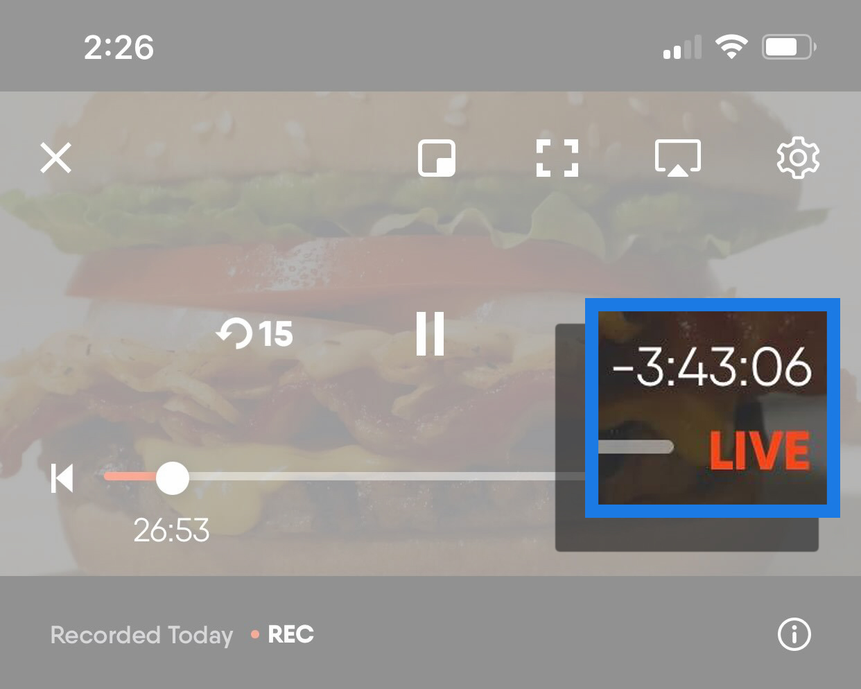 A live event on the FuboTV app on a mobile device with the live button highlighted; pressing this button will automatically jump to live programming.